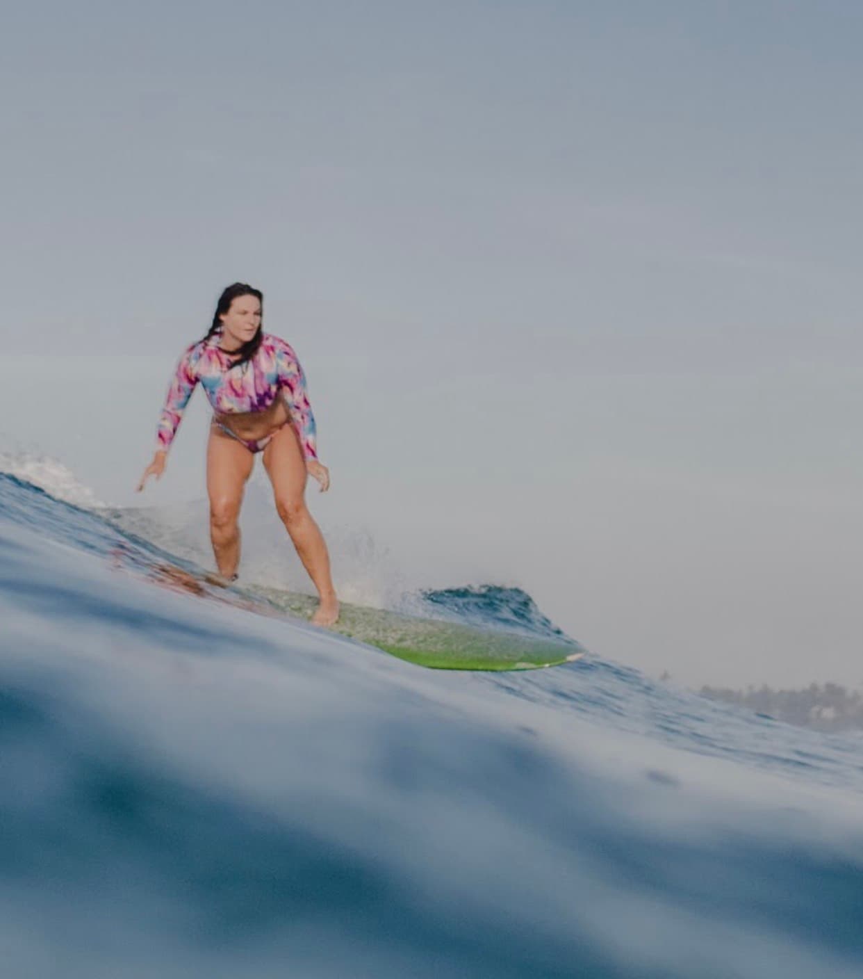 Alana Kane surfing